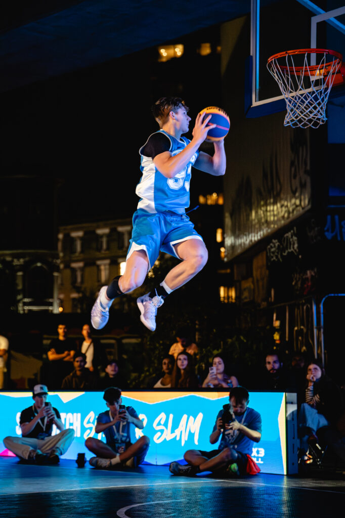 Cam Hazzard dunking a basketball